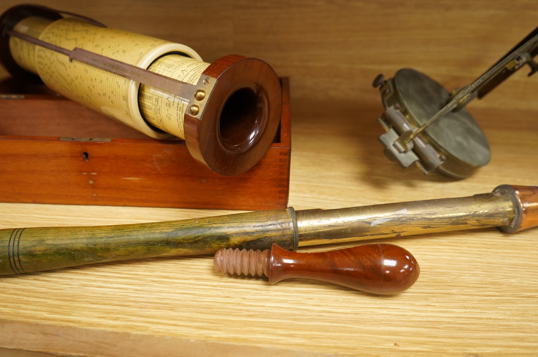 A brass and glass thermometer, with an ash handle, together with an early 19th century brass mining theodolite, by William Wilton, St. Day, Cornwall, (2)